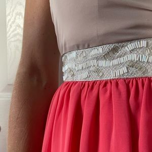 High-low strapless dress with intricate beading